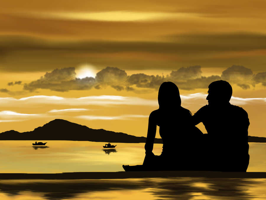 image of couple watching sunset